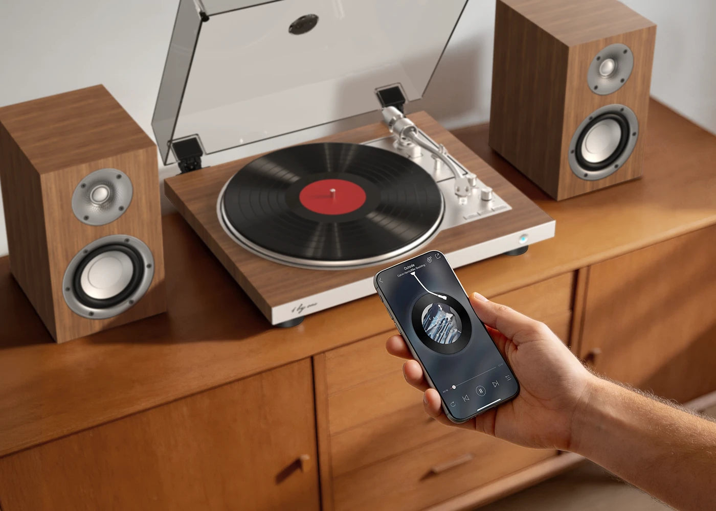 Smartphone streams to a bluetooth record player on a cabinet for a record player speakers bluetooth experience.