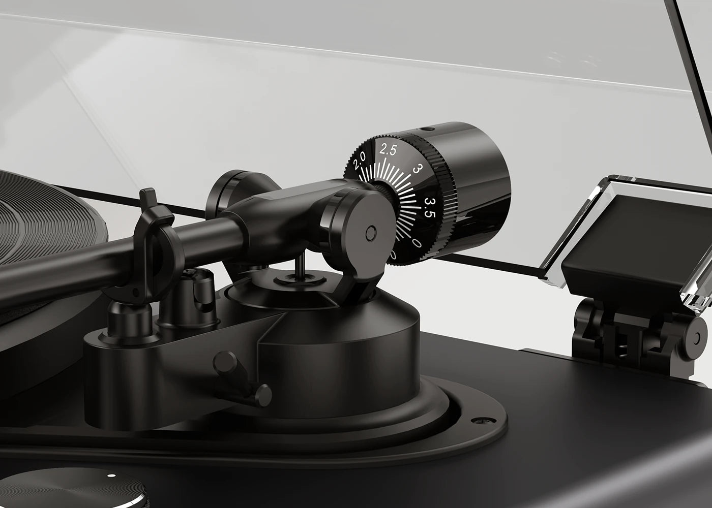 Close-up of the adjustable tonearm counterweight on a manual belt-drive turntable.