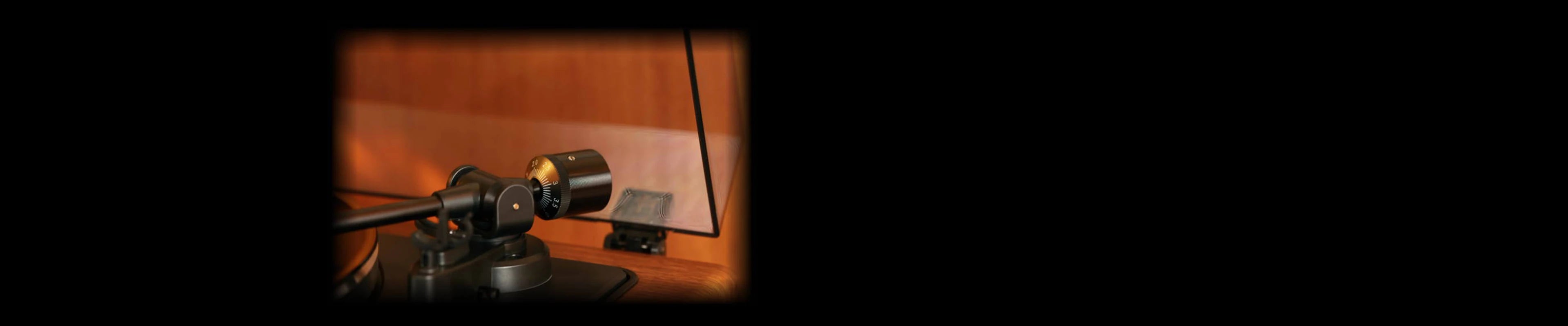 Detailed view of the adjustable counterweight, showcasing the precision of this manual record player setup.