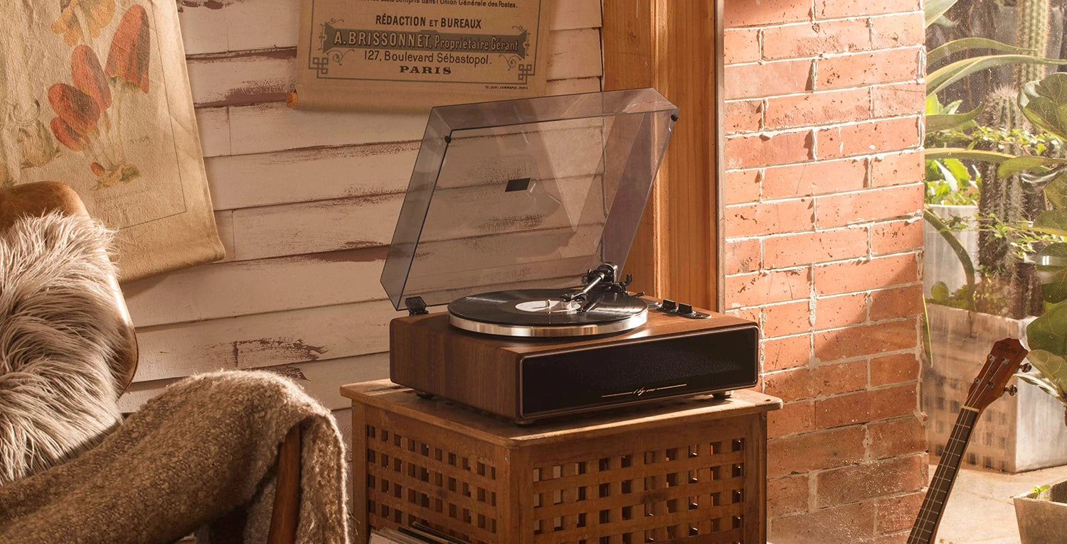 Cozy room featuring a vintage record player on a rustic table, highlighting a premium wooden record player design.